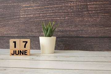 17 June wooden calendar with customizable space for text or ideas.