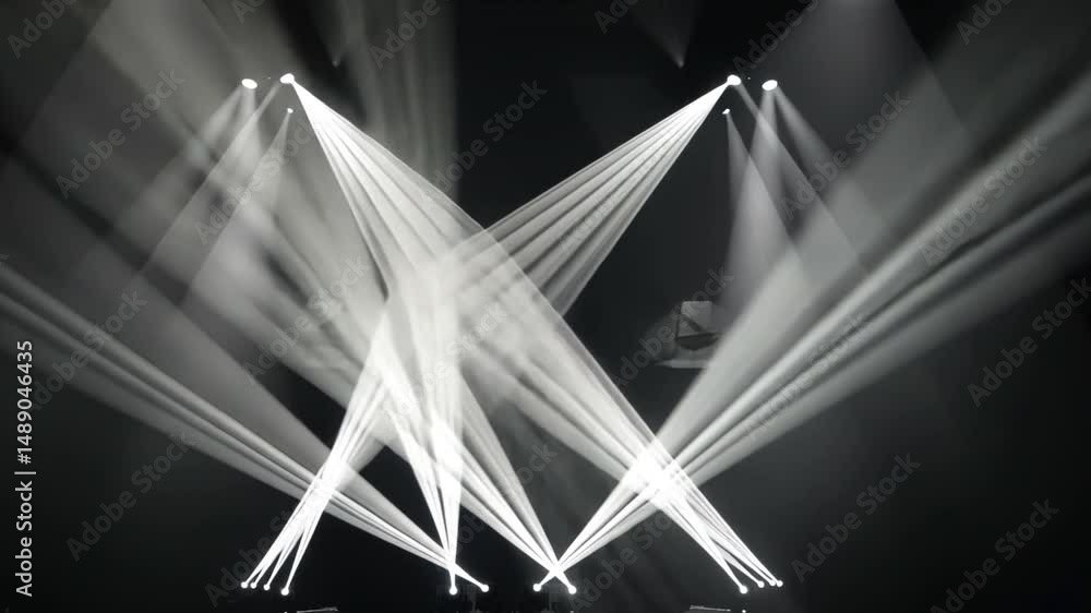 Poster dynamic light beams and vibrant illumination create energetic atmosphere on stage, showcasing stunni