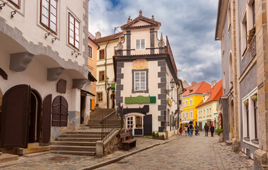 Historic cobblestone street with colorful buildings in Cesky Krumlov, Czech Republic