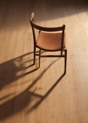 Crisp shadow of simple chair on polished wood surface, realistic, design, simple