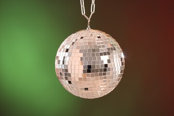 Shiny disco ball on color gradient background