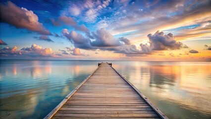 Obraz premium Serene Sunset Over Tranquil Waters A Wooden Dock Extends Towards a Colorful Horizon, Reflecting the Peaceful Beauty of Nature
