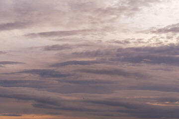 Clouds Sunset Sky: Atmospheric panoramic view of colorful sunset cloudscape, displaying nature's beauty at dusk.