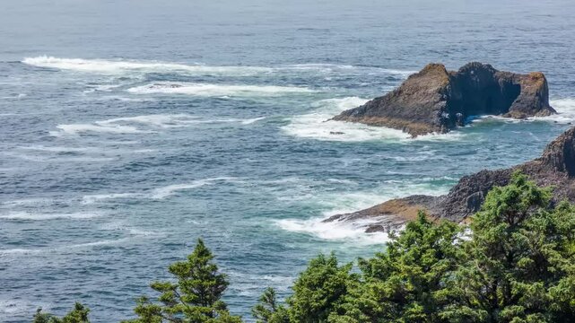 Footage shows Cape Falcon in Oswald West State Park, Oregon. Popular hiking destination with dramatic coastal views, lush forest, and panoramic ocean horizon.