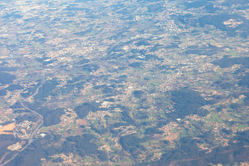 Aerial view of Portugal captures a sprawling landscape with scattered towns nestled among rolling...