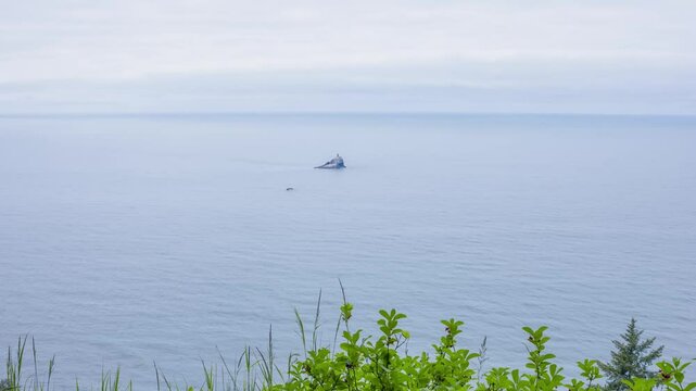 Tillamook Rock Light, a now-deactivated lighthouse on the Oregon Coast, stands on a rugged sea stack. Known as Terrible Tilly, it operated from 1881 to 1957.