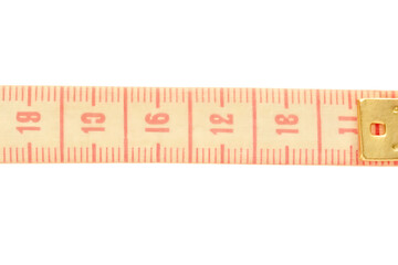 Close up of a beige fabric measuring tape with pink markings showing inches 11 to 18