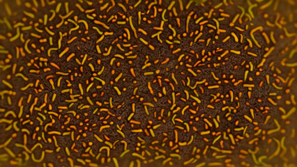 Abstract pattern of  brown, orange and yellow shapes resembling microorganisms