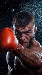 A man in a boxing glove is in the middle of a punch