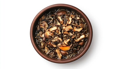 Wild rice and mushroom soup in brown bowl, viewed from directly above, isolated