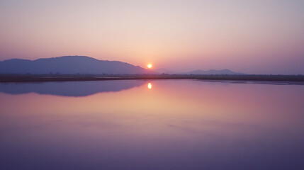 Naklejka premium Sunrise over the vast expanse of Salt pans in Kampot (2)