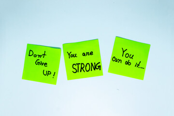Positive affirmations concept. Phrases of different colors sheets for notes on a white background....