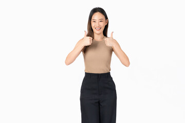 Fototapeta premium Smiling Asian woman enthusiastically with gives a thumbs up, signaling approval or like on a white background.