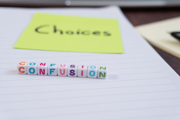 On a sheet of paper, there are some colored cubes with letters spelling the word 