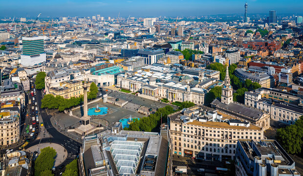 Aerial view of Trafalgar Square in London with fountains, Nelson&rsquo;s Column, and surrounding historic and modern architecture