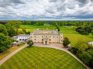 Aerial view of Syon House, a historic stately home in London, surrounded by lush greenery and landscaped grounds