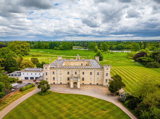 Aerial view of Syon House, a historic stately home in London, surrounded by lush greenery and landscaped grounds