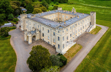 Aerial view of Syon House, a historic stately home in London, surrounded by lush greenery and landscaped grounds