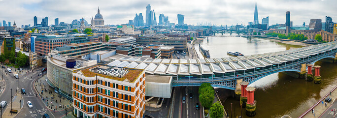Aerial view of Blackfriars station with solar panels on the roof, London skyline and St. Paul’s...