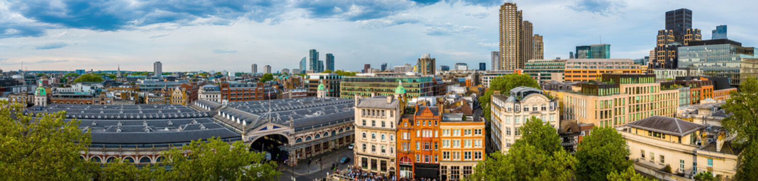 Aerial view of Smithfield Market in London, featuring historic architecture, city streets, and surrounding modern urban buildings