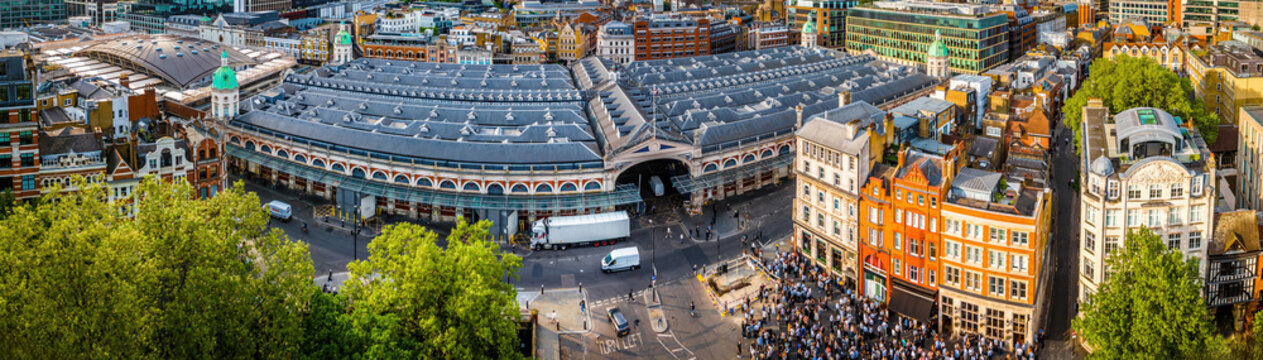 Aerial view of Smithfield Market in London, featuring historic architecture, city streets, and surrounding modern urban buildings