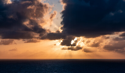 Dramatic Sunset Over the Ocean with Clouds And Vibrant Colors