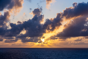 Majestic Sunset Over Ocean Horizon with Vibrant Clouds in the Pacific