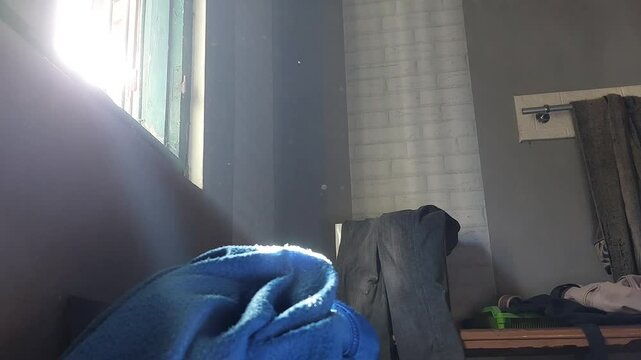 Tyndall effect footage, which is a natural phenomenon that occurs when light passes through a medium containing small particles such as dust, smoke, or colloids.