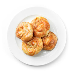Fresh loaf of breads or buns with cottage cheese on plate isolated on white background. Pastries and bread, top view, close up