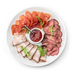 Antipasto platter cold meat, prosciutto, slices ham, beef jerky, salami and sauce isolated on white background. Meat appetizer. Top view, close up
