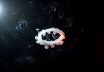 Smoke ring against dark background