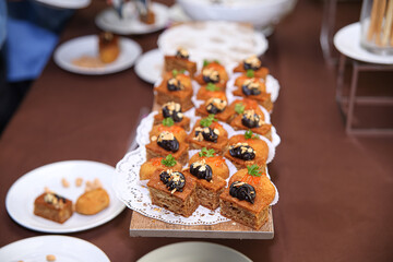 Sweet cake at an event. Cake serving at a party