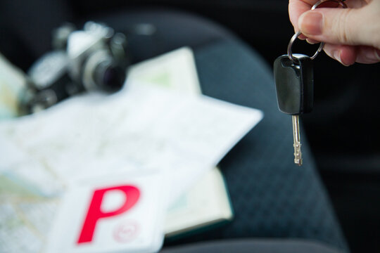 Red P plates and keys on back seat of car