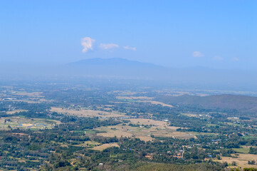 Distant Mountains and Forest with Trees and Sky in Northern Thailand.