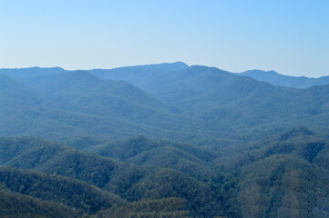 Fototapeta premium Distant Mountains and Forest with Trees and Sky in Northern Thailand.