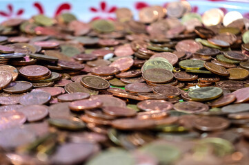 A lot of coins focus in the middle of the picture.