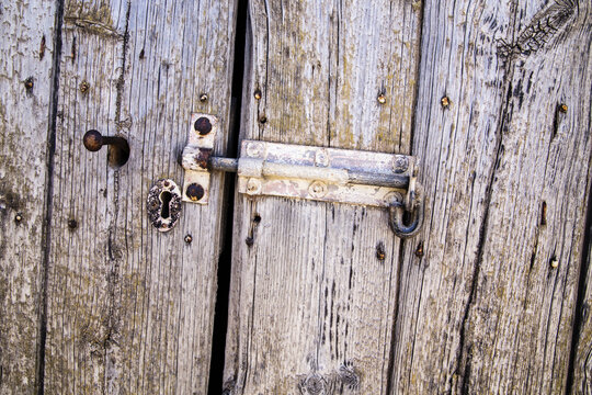 Weathered timber door with hasp