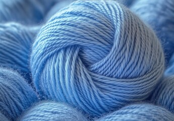 Close-up of multiple soft light blue yarn balls tightly wound and arranged together
