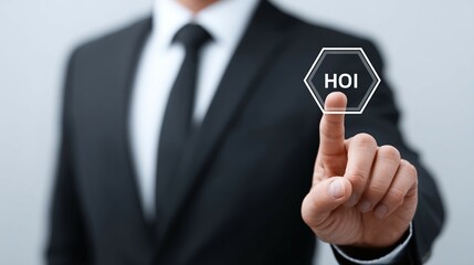Obraz premium Man in suit points to a hexagon with 