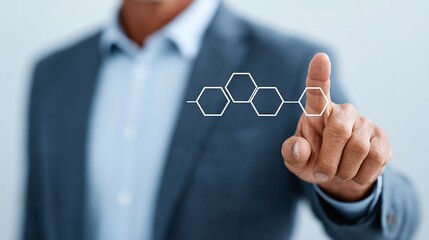 Person in suit touching a digital molecular structure on a light background.