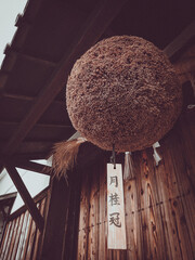 A sugidama hanging in front of a Japanese brewery