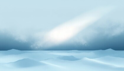 Calm and misty seascape with gentle waves under a pale blue sky and soft light breaking through clouds