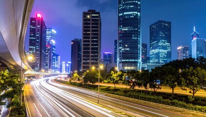 Obraz premium Captivating nighttime cityscape featuring vibrant light trails and modern architecture