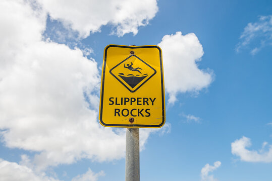 Slippery Rocks sign against sky
