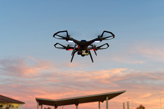 Close-up of drone, uav, rpas flying at sunset with copy space