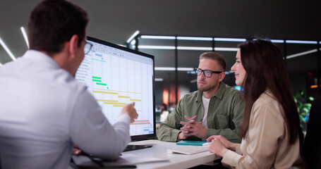 Efficient Hispanic Event Planner Organizing Busy Office Schedule