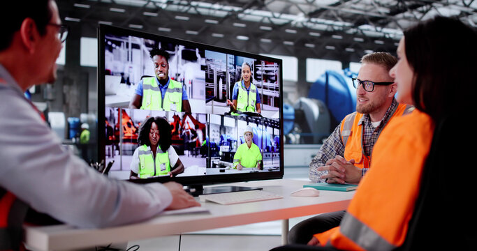 Man And Woman Meeting In Video Call At Manufacturing Factory. Young Engineers