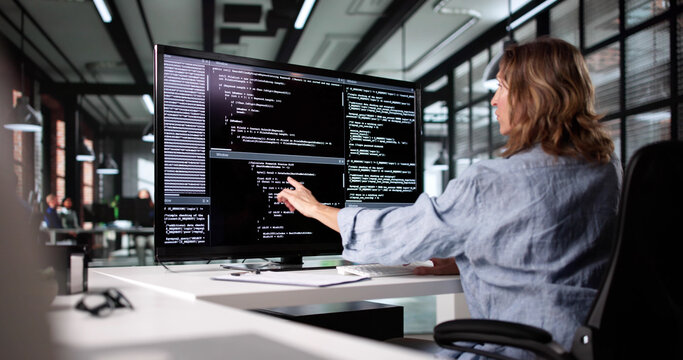 Female Web Developer Working On Software Code