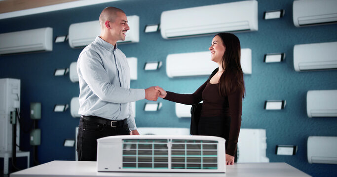 Expert Salesman Provides Expert Advice On Air Conditioning Choices