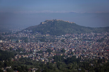 Aerial View of Srinagar City with Houses, Waterways, and Mountains